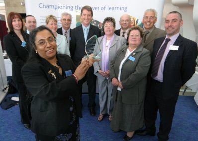 Employer Training Pilot Employees show off their award